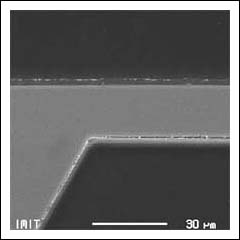 Photo 1. Anisotropic etching achieves extreme precision in fabricating mechanical structures such as the pressure sensor diaphragm shown here in cross section.