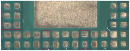 Figure 3. Examples (in red rectangles) of neighboring LGA pads having solder mask variation.