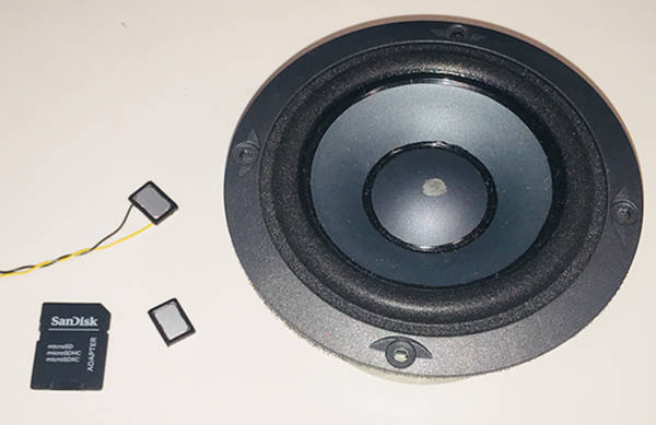 Figure 2. Size comparison of micro speakers vs. a traditional speaker.