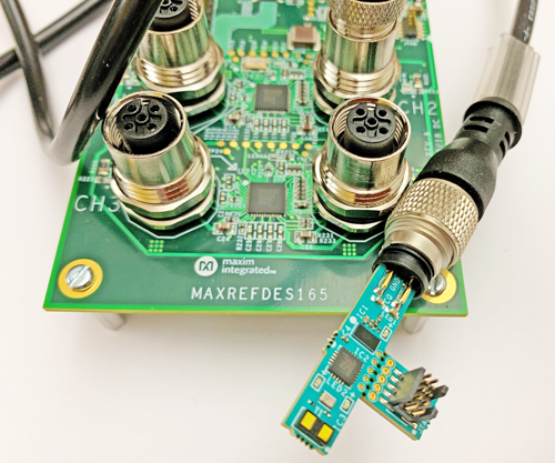 Figure 2. The MAXREFDES171# reference design (right) connected to the MAXREFDES165# IO-Link master reference design (left) for verification.