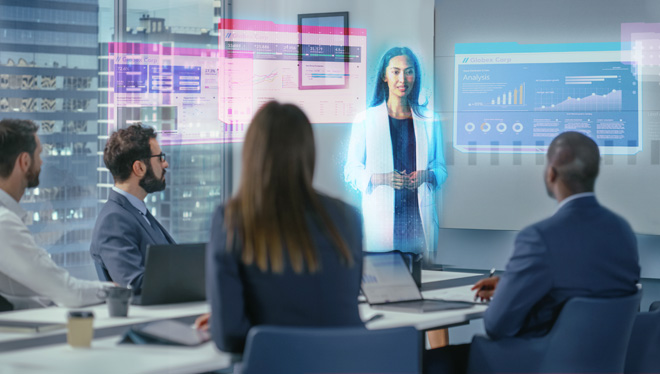 People in an office seeting during a mixed reality and virtual communications meeting.