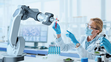 Robot giving lab worker a vial of red liquid