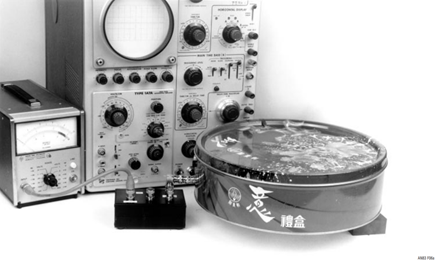 Figure 6a. LDO noise measurement bench setup. Shielded can contains regulator; noise filter circuitry occupies box at photo lower center. Oscilloscope and RMS voltmeter are not simultaneously connected, precluding ground loop from corrupting measurement