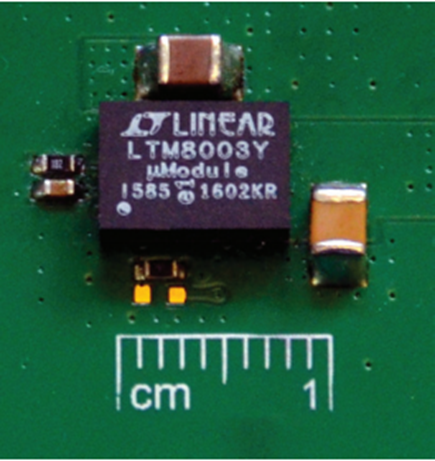 A complete step-down solution is barely larger than the 6.25 mm × 9 mm footprint of the LTM8003 µModule regulator