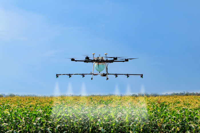 A drone being used to spray crops.