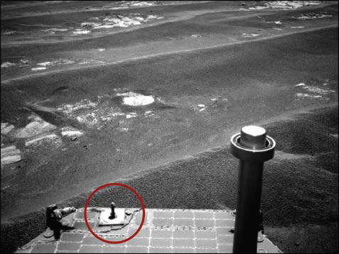 Figure 1. NASA's Mars Exploration Rover Opportunity used its navigation camera to record this view after completing a drive on July 17, 2011. The calibration standard (circled) was essential for the mission. Image courtesy of NASA/JPL-Caltec.