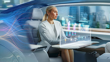 Woman in a sleek autonomous vehicle with digital screen and city views.