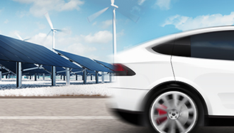 Electric vehicle driving in front of wind turbines and solar storage containers